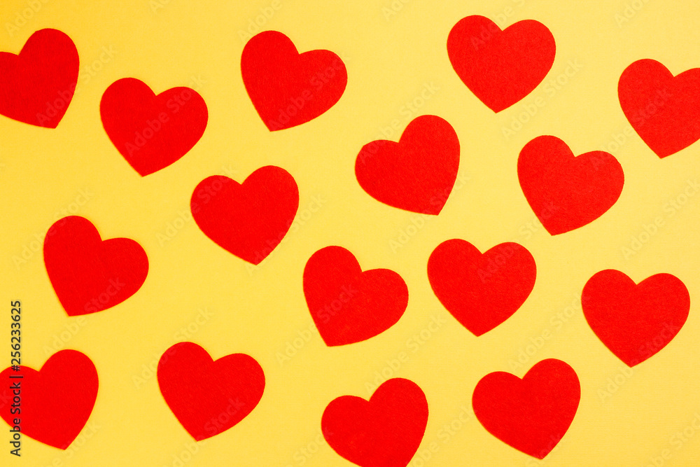 Red hearts on yellow background