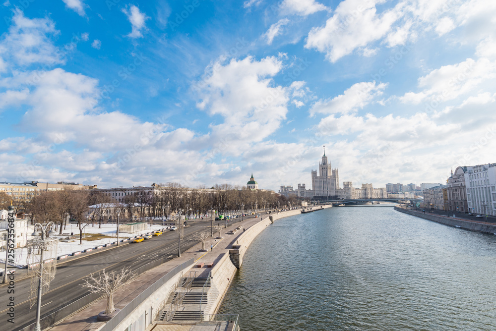 City landscape with view on Moscow Kremlin and reflections in waters of Moskva river.