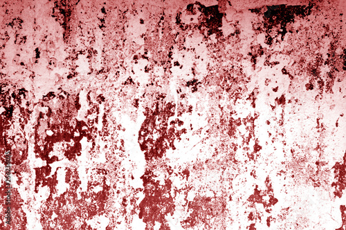 Сraked weathered cement wall texture in red tone.