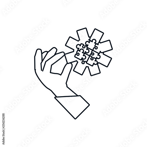 hand with puzzle pieces in shape pinion