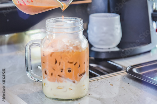 Ice thai tea with milk, traditional Indian drink is iced tea or chai masala, Milk tea, Orange tea