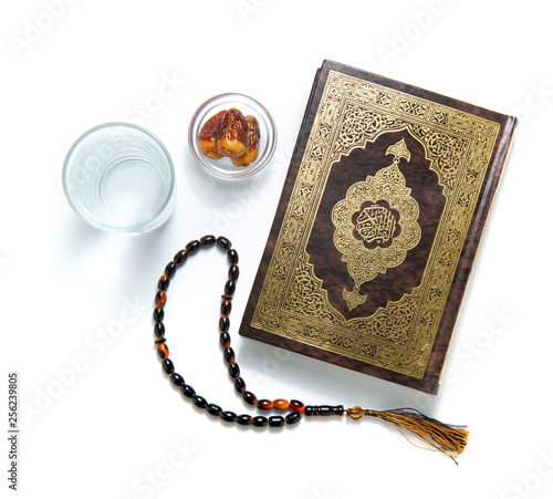 Quran Holy Book, Water, Dates and Rosary, Isolated on White