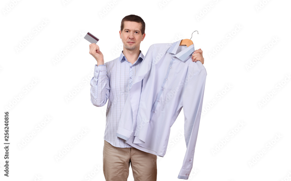 the man holds a coat hanger with a shirt and the plastic card on a white background the man holds a coat hanger with a shirt and the plastic card on a white background