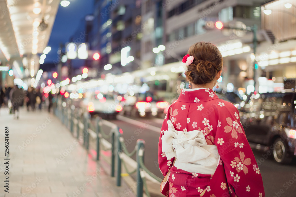 Woman wearing traditional kimono on a street in Japan