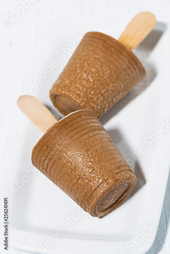 homemade chocolate popsicles on a stick