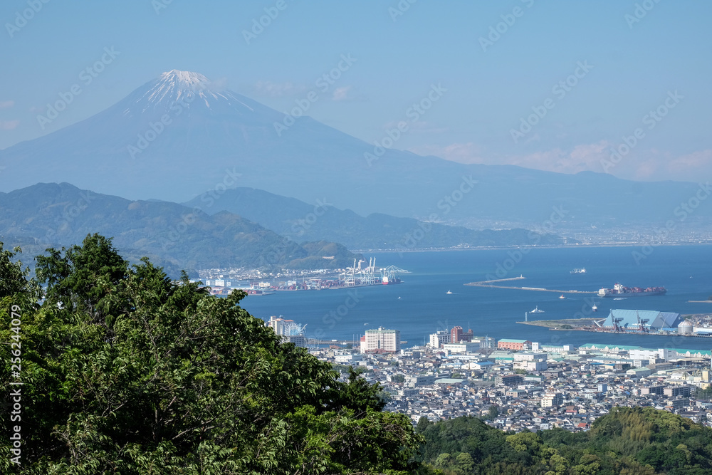 Japan city view overlooking Mt. Fuji and the sea.