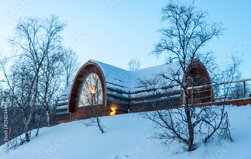 Snow covered cabin in the woods, Kirkenes, Norway