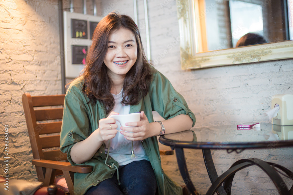 Business women drinking with latte coffee cup in cafe Business women drinking with latte coffee cup in cafe