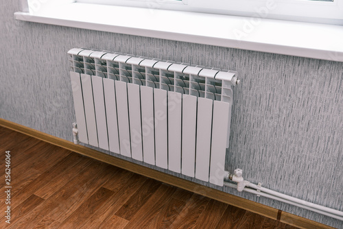 Wallpaper Mural Modern radiator in the house or apartment. Household bimetallic batteries. Panel water radiator system in a residential area Torontodigital.ca