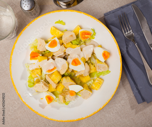 Tasty salad with chicken,  egg and sweet pineapple