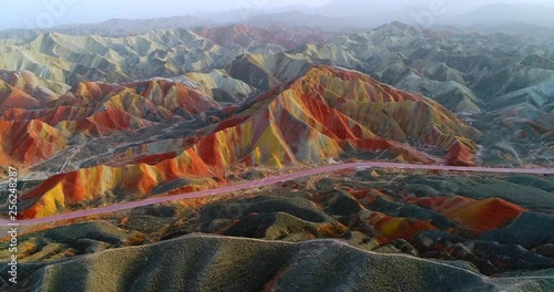 Aerial 4k drone footage of most colorful mountains on earth, the rainbow mountains of Zhangye Danxia National Geological Park. Shown is the most vibrant, multicolored part of this amazing landscape.