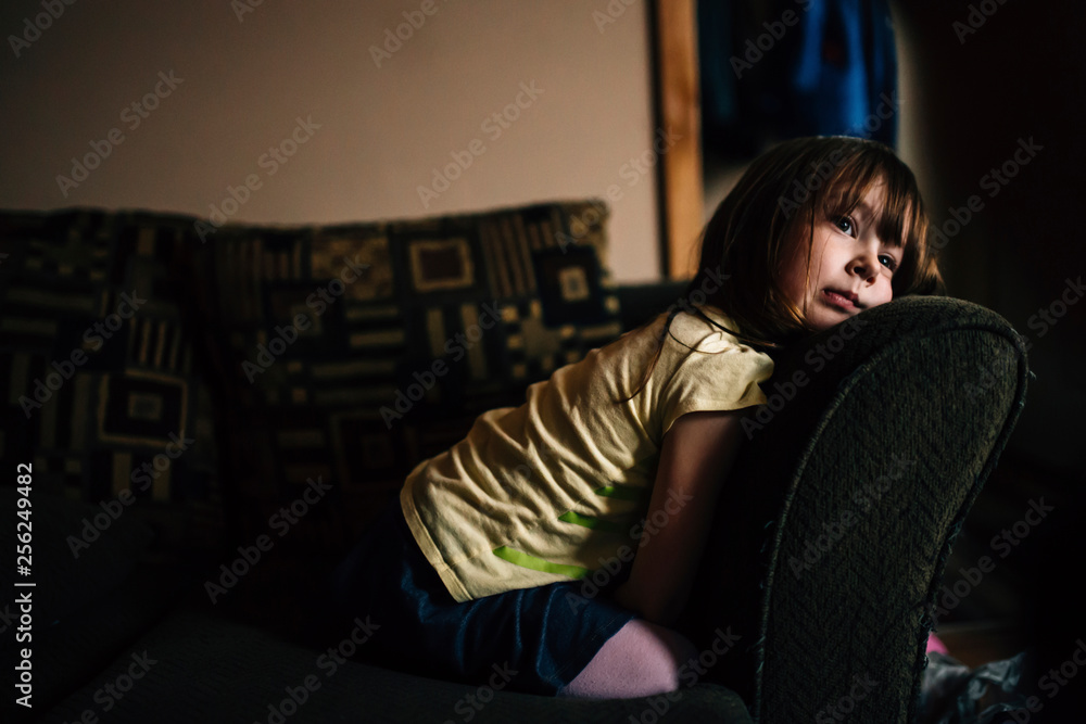 Girl relaxing on sofa at home Girl relaxing on sofa at home