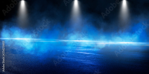 Background of the room with concrete pavement. Blue and pink neon light. Smoke  fog  wet asphalt with reflection of lights. Abstract light  searchlight rays. Night view of the street with lights  dark