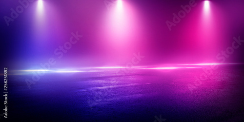 Background of the room with concrete pavement. Blue and pink neon light. Smoke, fog, wet asphalt with reflection of lights. Abstract light, searchlight rays. Night view of the street with lights, dark