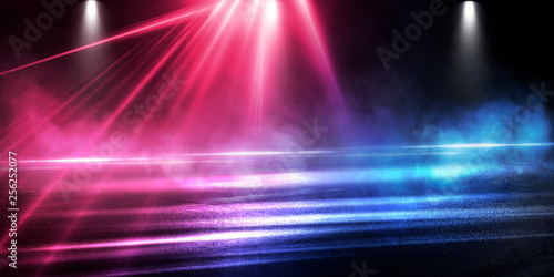 Background of the room with concrete pavement. Blue and pink neon light. Smoke, fog, wet asphalt with reflection of lights. Abstract light, searchlight rays. Night view of the street with lights, dark