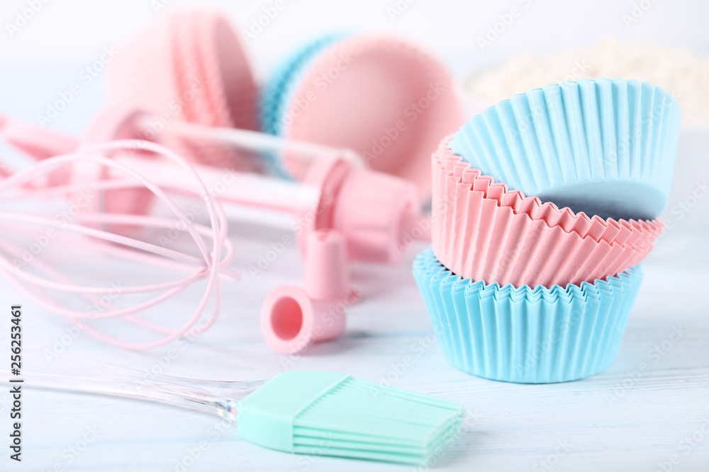 Colorful cupcake cases with kitchen utensils Colorful cupcake cases with kitchen utensils