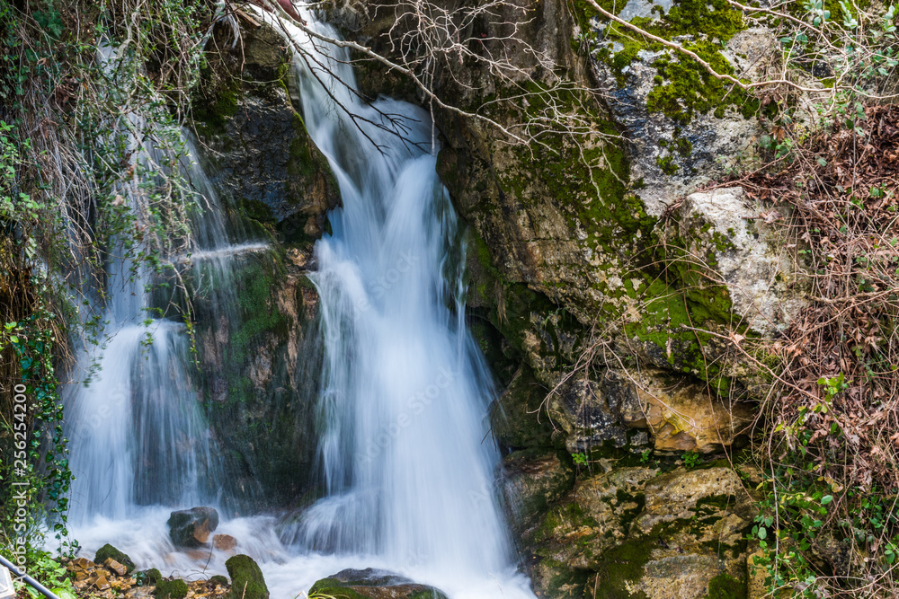 Naklejka premium This is a capture of a waterfall located in north Lebanon and it is a longtime exposure shot to achieve this silky texture of the water