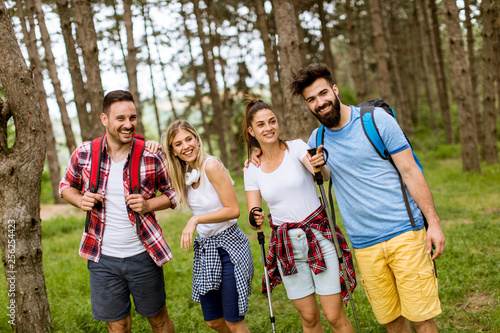 Group of four friends hikin...