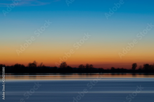 sunrise sky over the water © Cosminxp
