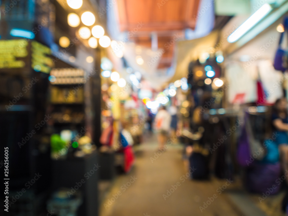 Fototapeta premium Blurred group of tourist people shopping in souvenir shop