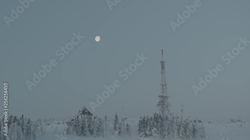 Wallpaper Mural Aerial drone view of shelter and transmitter tower at sunrise in winter in mountains with full moon in background  Torontodigital.ca