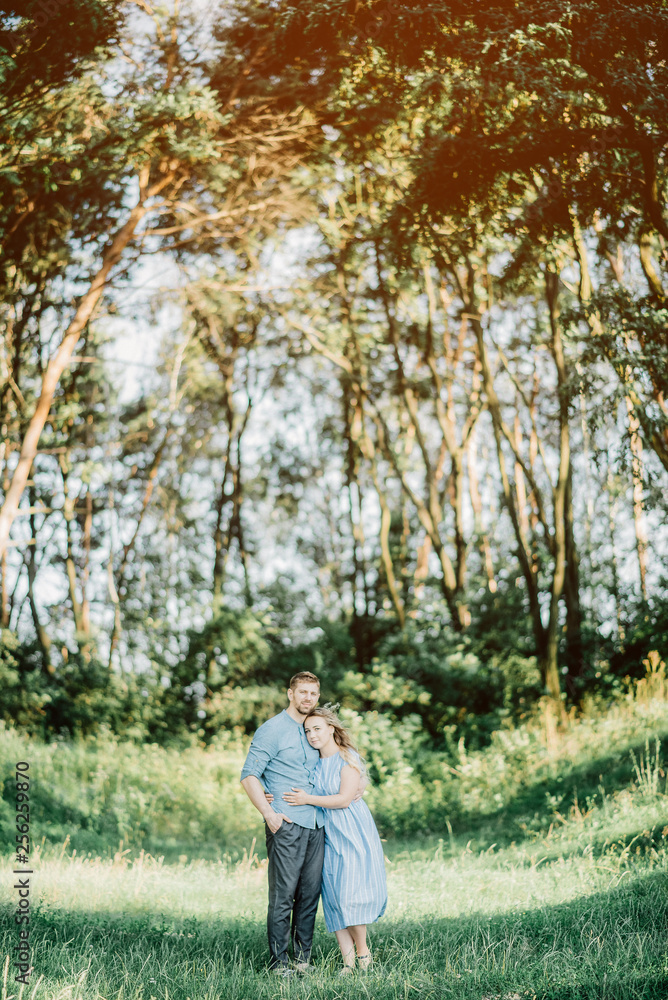 Happy young family spending time together outside in green nature Happy young family spending time together outside in green nature