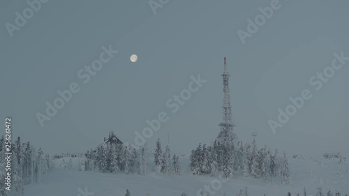 Wallpaper Mural Aerial drone view of shelter and transmitter tower at sunrise in winter in mountains with full moon in background  Torontodigital.ca