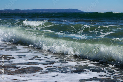 Freshness of the sea wave on a sunny day in Greece