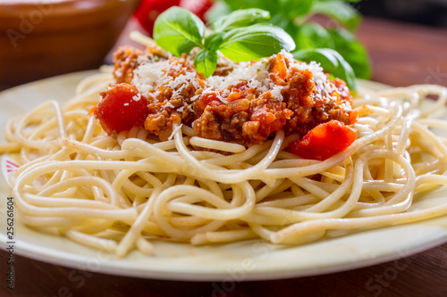 Spaghetti Bolognese with cheese and basil