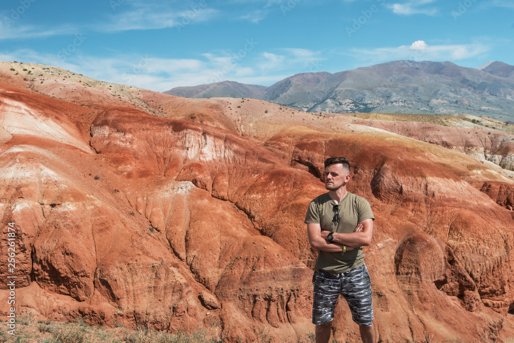 Relaxing man in Valley of Mars landscapes in the Altai Mountains, Kyzyl Chin, Siberia, Russia