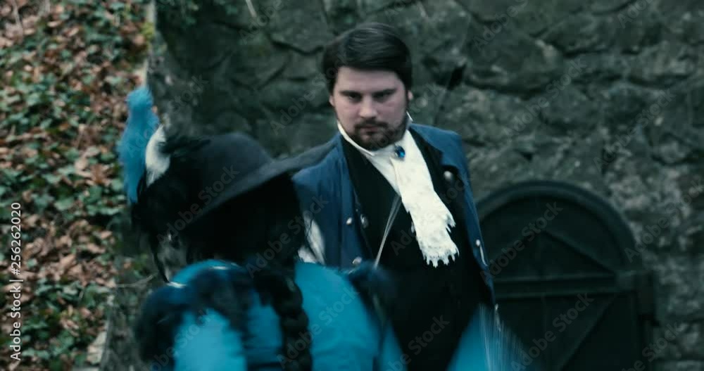 Medium Close Up Two musketeers fight sword background door Medium Close Up Two musketeers fight sword background door