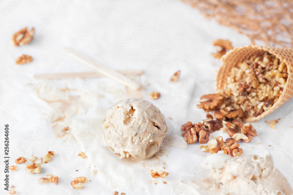 Honey and yogurt Ice Cream with shelled walnuts in cone Honey and yogurt Ice Cream with shelled walnuts in cone