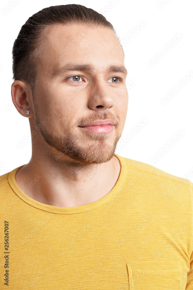 Fototapeta premium Portrait of young man posing on white background