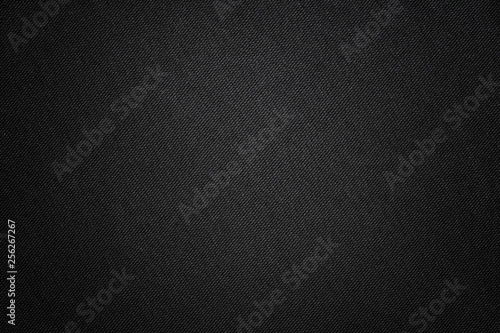 Black fabric texture. Textile background with vignette