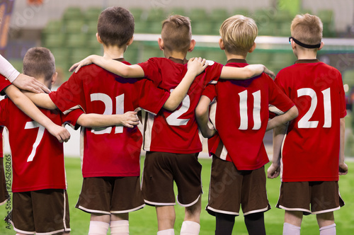 Children in Sportswear Standing in Team. Kids in Red Jersey Shirts. Kids Standing in Row During Penalty Kicks