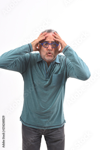 man with expression of forgetfulness or surprise on white background