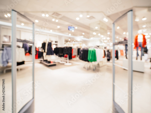 Abstract blurred entrance area of cloth store as background. Clothes shop blur
