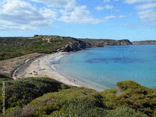 picture of the coast of the beautiful Menorca island in Spain. the mix of the green and blue colours of water and land create a beautiful natural effect. 