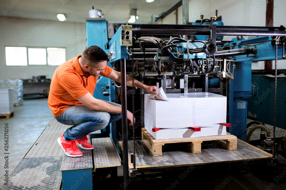 Man working in printing factory Man working in printing factory
