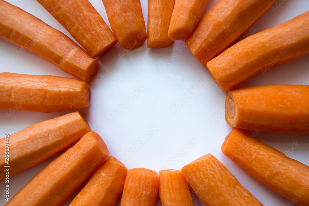 Frame in the form of the sun from peeled carrots