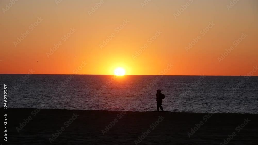Silhouette of Man Carrying Bag and Pole Silhouette of Man Carrying Bag and Pole