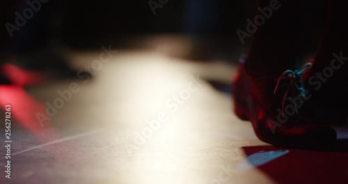 Young woman doing a spinning dance move on the dancefloor