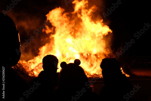 people staring at traditional bonfire