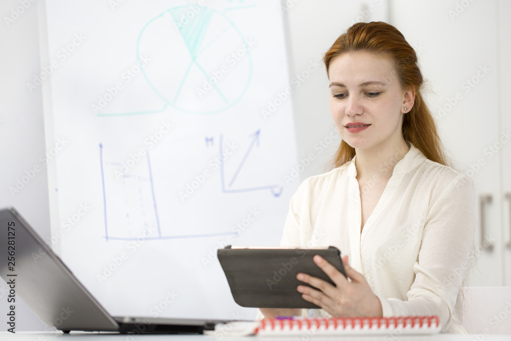 Businesswoman working at her office Businesswoman working at her office