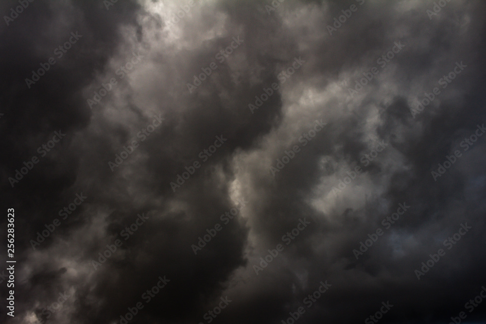 Huge gray storm clouds cover the entire sky. Huge gray storm clouds cover the entire sky.