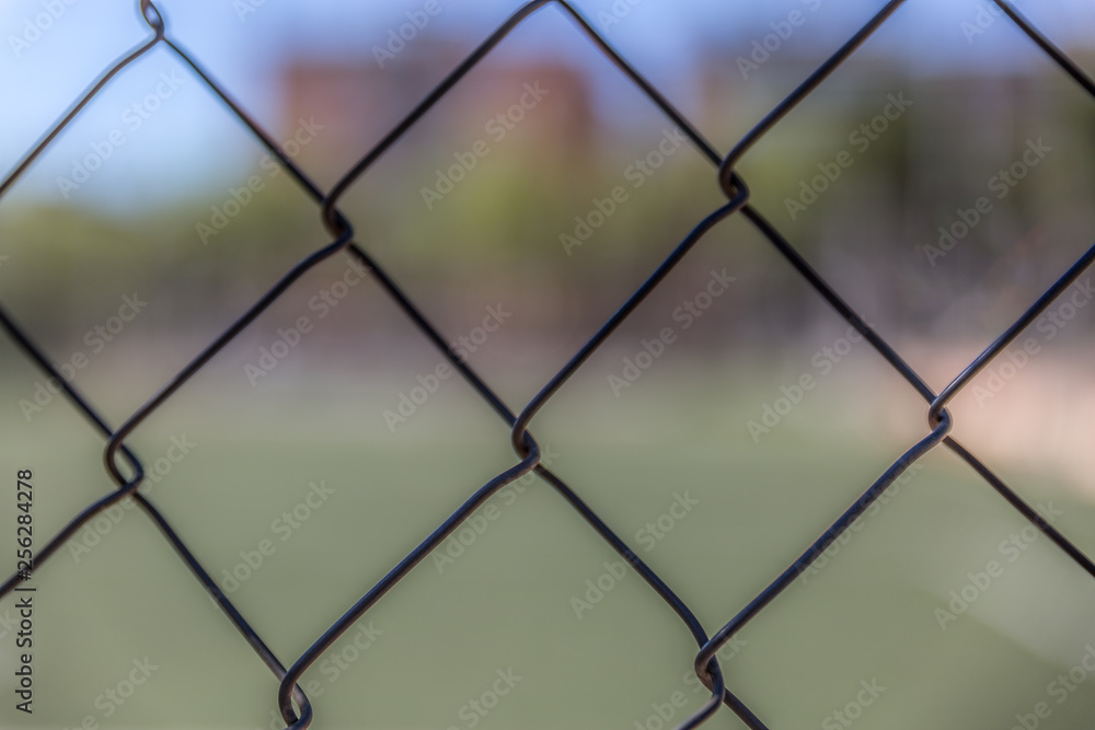 Fototapeta premium Background formed by a metal rhombus fence