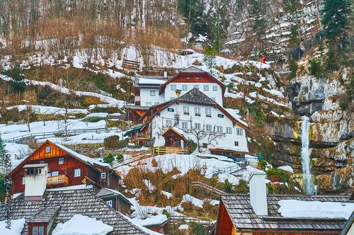 The houses on the rocky slope of Salzberg mountain, Hallstatt, Salzkammergut, Austria photo