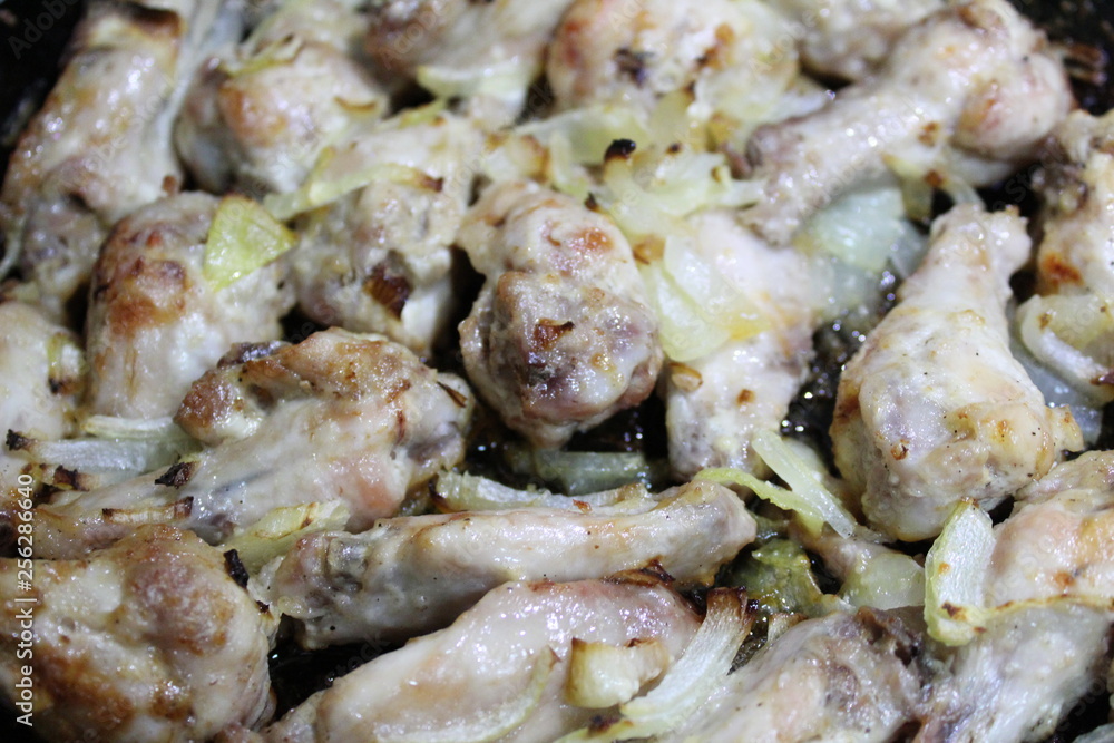 chicken fried with onions in a pan chicken fried with onions in a pan