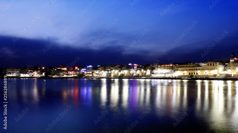 panorama night view to Pushkar city with holy lake in the center, Rajasthan, India