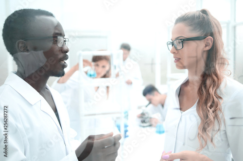 multinational scientists work in a modern laboratory